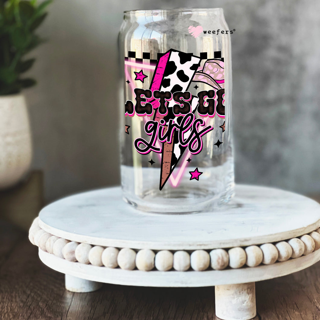a glass jar with a pink and black design on it