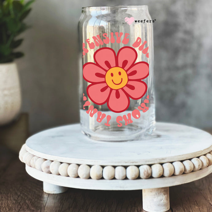 a glass jar with a flower painted on it