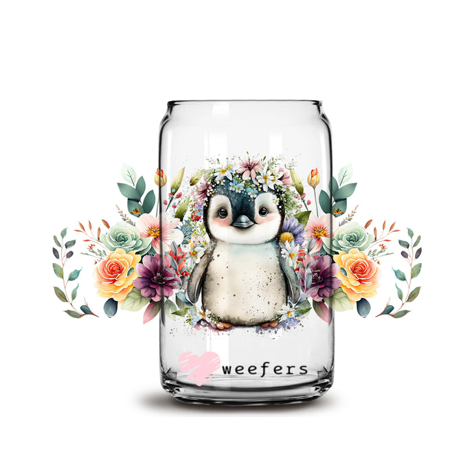 a glass jar with a picture of a penguin inside of it