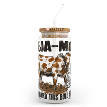 Load image into Gallery viewer, a glass jar with a straw in it with a picture of a cow on it
