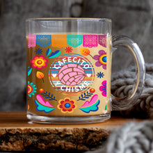 Load image into Gallery viewer, a glass mug with a colorful design on it
