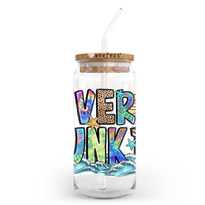 a glass jar with a straw in it that says we're junk