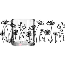 Load image into Gallery viewer, a glass mug with a drawing of flowers on it

