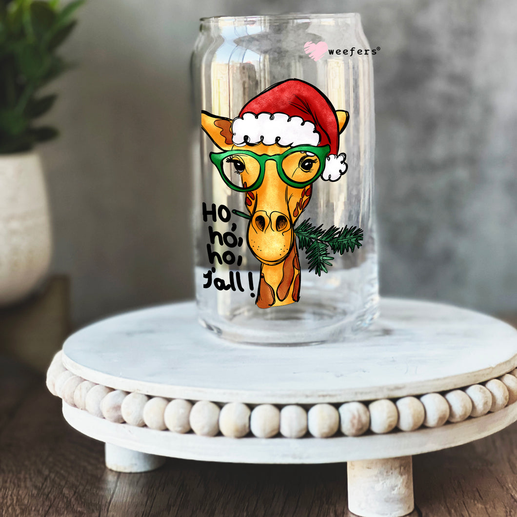 a glass with a giraffe wearing a santa hat and glasses