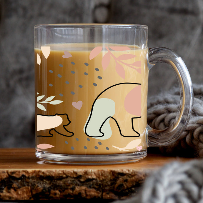 a glass mug with a picture of a polar bear on it
