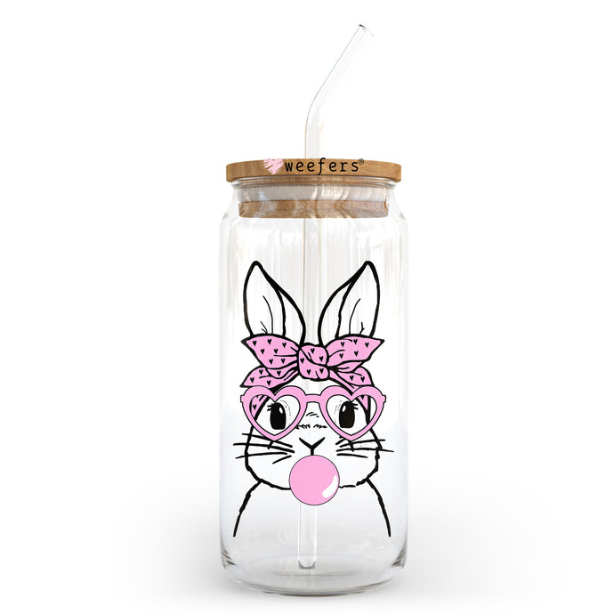 a glass jar with a straw in the shape of a bunny with a pink bow