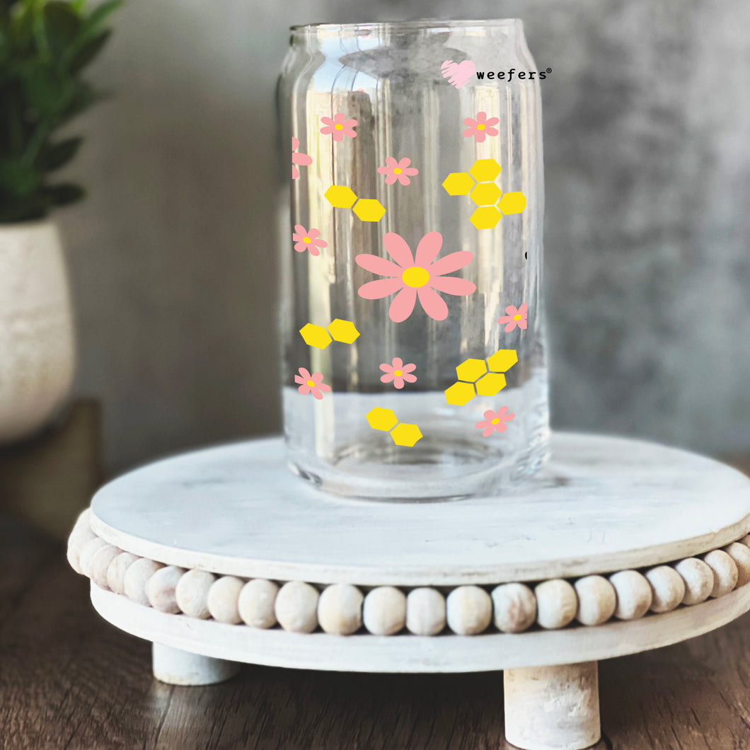 a glass vase with flowers painted on it