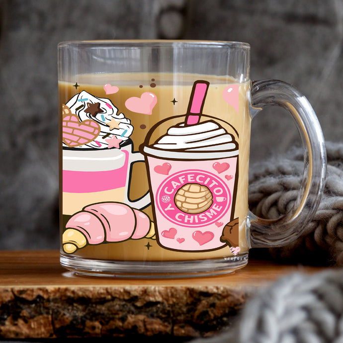a cup of coffee with a pink drink on it