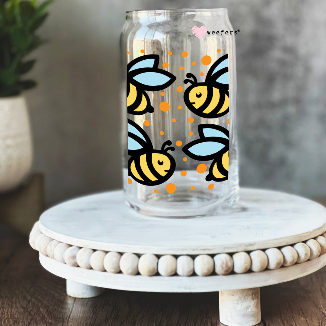 a glass jar with bees painted on it