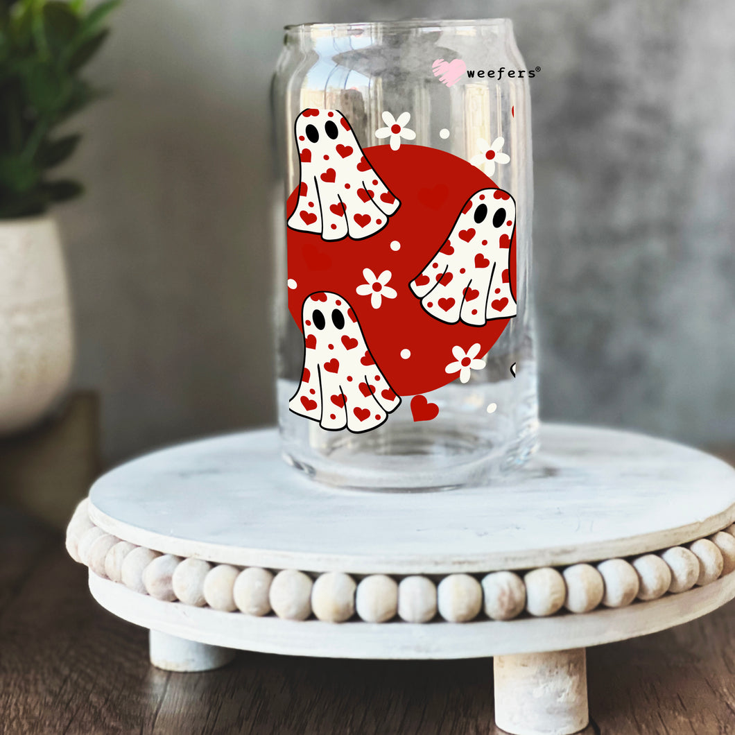 a glass jar with a red and white design on it