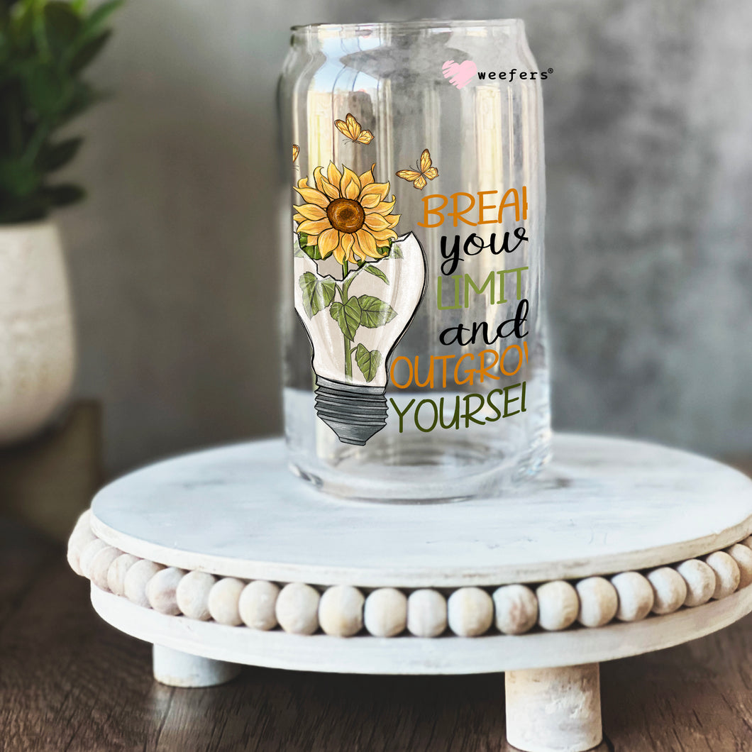 a glass jar with a sunflower on it
