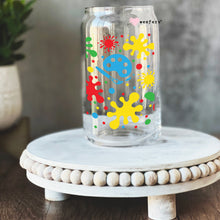 Load image into Gallery viewer, a glass jar with a colorful design on it
