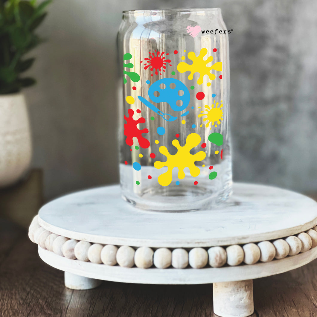a glass jar with a colorful design on it