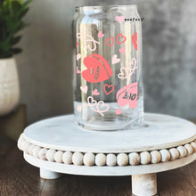 Load image into Gallery viewer, a glass jar with hearts painted on it
