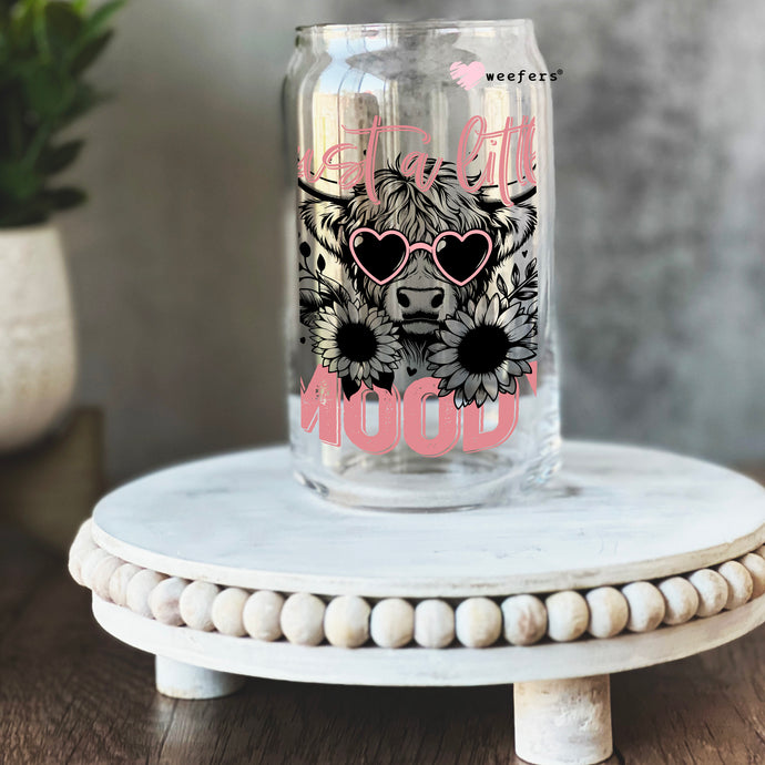 a mason jar with a picture of a bear wearing sunglasses