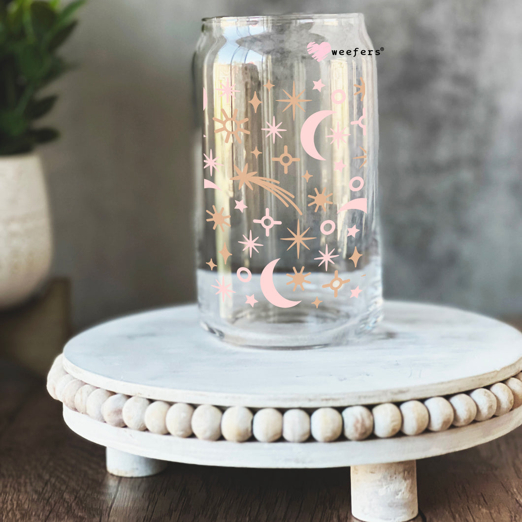 a glass jar with stars and moon painted on it