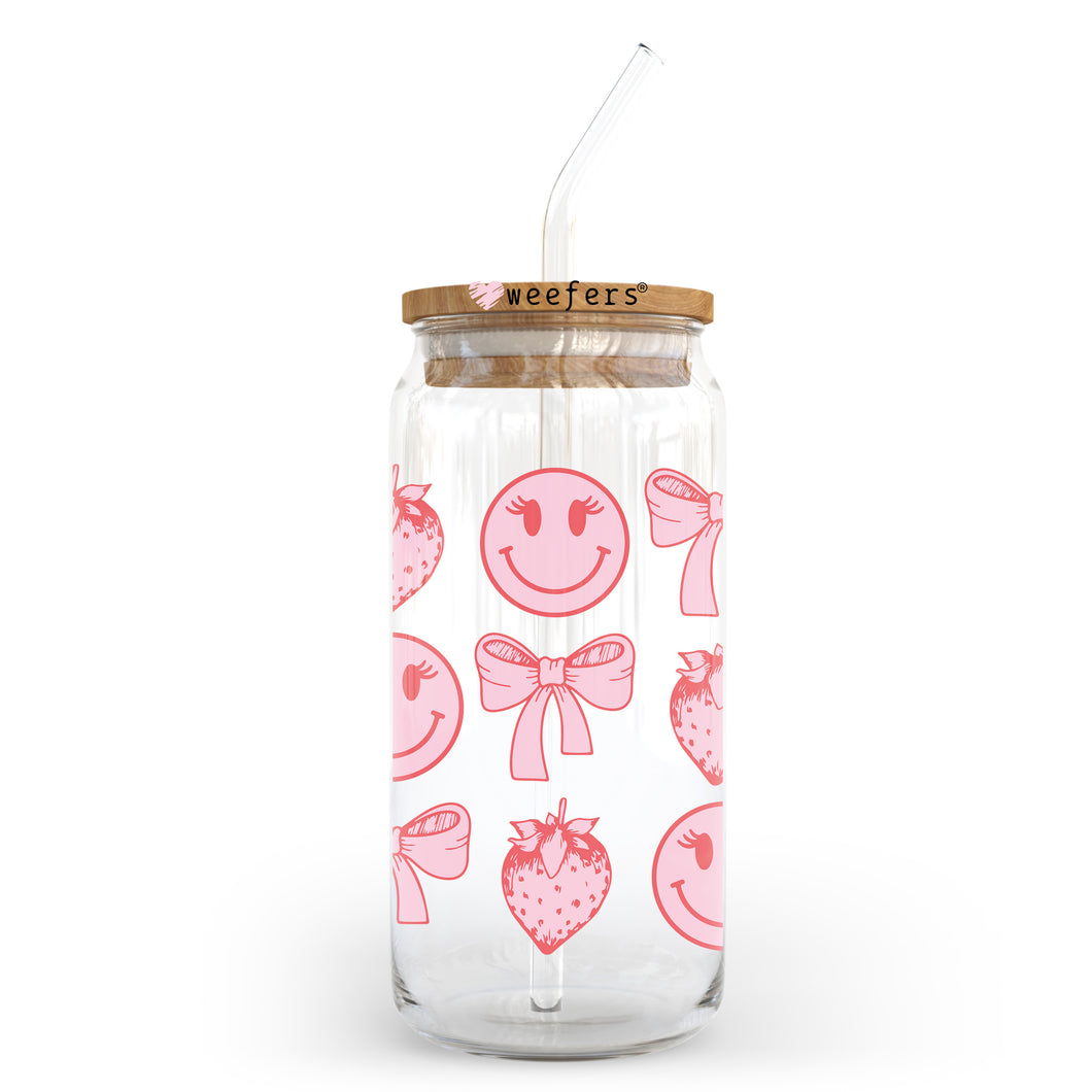 a glass jar filled with strawberries and a straw