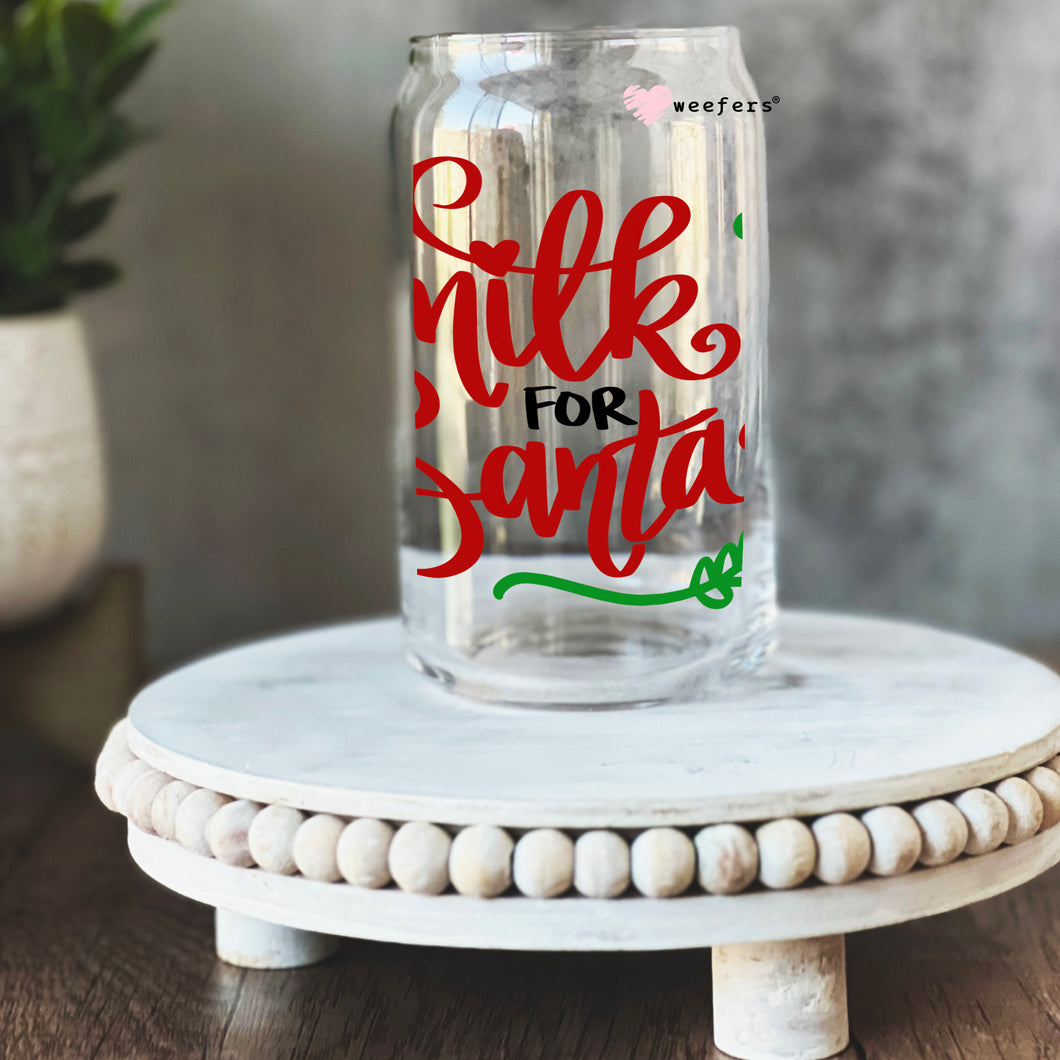 a glass jar with the words milk for santa on it