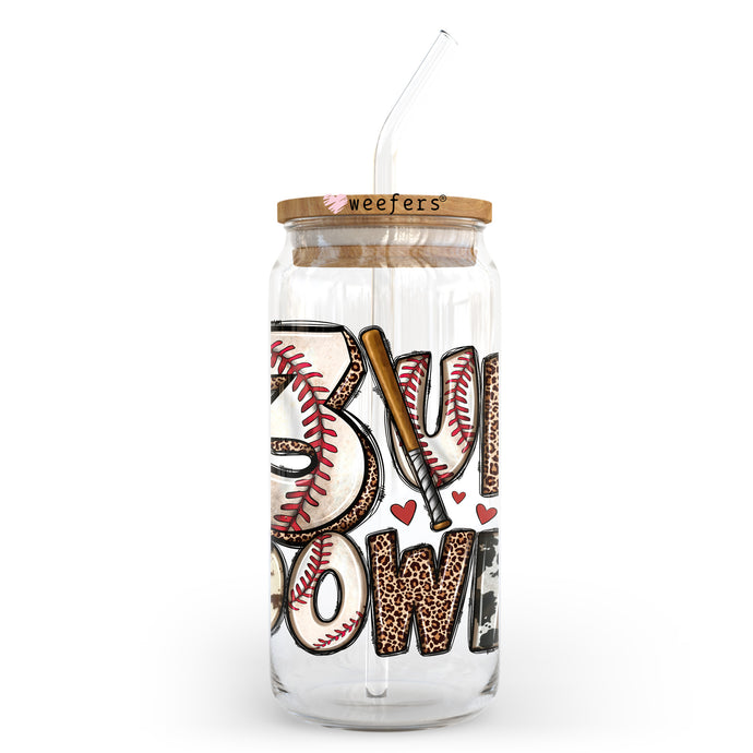 a glass jar with a straw and a baseball on it