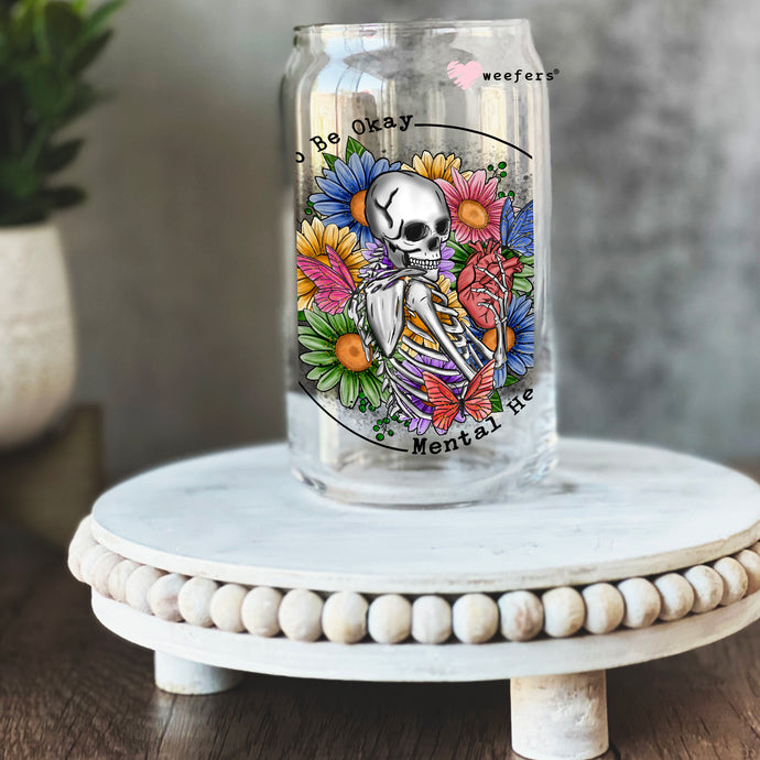 a glass jar with a picture of a skeleton on it