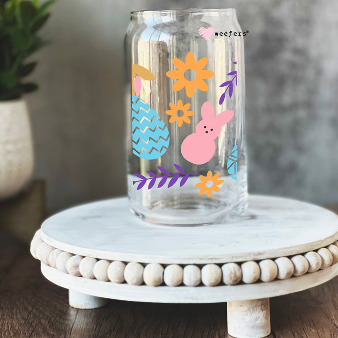 a glass jar with a bunny design on it