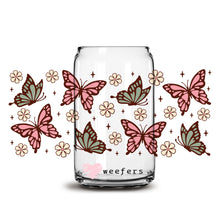 Load image into Gallery viewer, a glass jar filled with lots of butterflies
